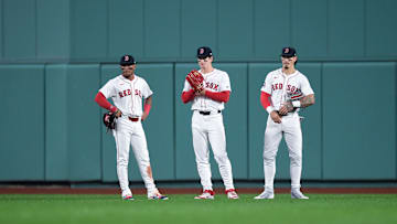Red Sox outfielders Ceddanne Rafaela, Jarren Duran and Roman Anthony watch from the outfield during a game versus the Rays.