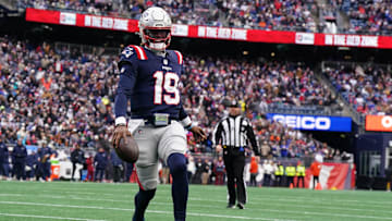 Jan 5, 2025; Foxborough, Massachusetts, USA; New England Patriots quarterback Joe Milton III (19) runs the ball for a touchdown against the Buffalo Bills in the first quarter at Gillette Stadium.