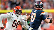 Denver Broncos quarterback Bo Nix (10) outruns Cincinnati Bengals defensive end Joseph Ossai (58) in the first quarter of the NFL Week 4 Monday Night Football game between the Denver Broncos and the Cincinnati Bengals at Empower Field at Mile High in Denver on Monday, Sept. 29, 2025.