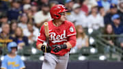 Sep 26, 2025; Milwaukee, Wisconsin, USA;  Cincinnati Reds center fielder TJ Friedl (29) hits a double during the third inning against the Milwaukee Brewers at American Family Field. Mandatory Credit: Jeff Hanisch-Imagn Images