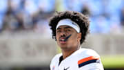 Oct 25, 2025; Chapel Hill, North Carolina, USA; Virginia Cavaliers linebacker Kam Robinson (5) on the sidelines in the first quarter at Kenan Stadium. Mandatory Credit: Bob Donnan-Imagn Images