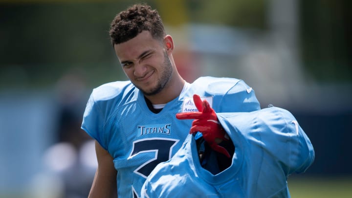 Tennessee Titans cornerback Caleb Farley (3), the Titans first-round draft pick in 2021, carries veteran players' shoulder pads after a training camp practice at Saint Thomas Sports Park Monday, Aug. 9, 2021 in Nashville, Tenn.