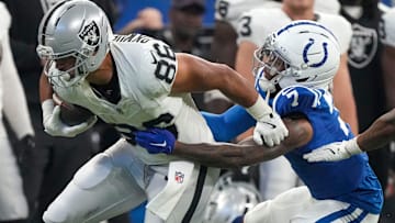 Oct 5, 2025; Indianapolis, Indiana, USA; Indianapolis Colts cornerback Charvarius Ward (7) attempts to bring down Las Vegas Raiders Albert Okwuegbunam Jr. (86) during a game  at Lucas Oil Stadium. Mandatory Credit: Christine Tannous-USA TODAY Network via Imagn Images