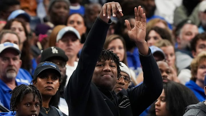 Grizzlies player GG Jackson mimes shooting the ball as he watches the game between UNC and Memphis in the Hoops for St. Jude Tip Off Classic at FedExForum on Tuesday, October 15, 2024.