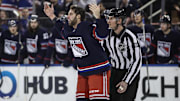 Dec 14, 2024; New York, New York, USA;  New York Rangers defenseman Connor Mackey (14) waves to the crowd in the first period after fighting against the Los Angeles Kings at Madison Square Garden. Mandatory Credit: Wendell Cruz-Imagn Images