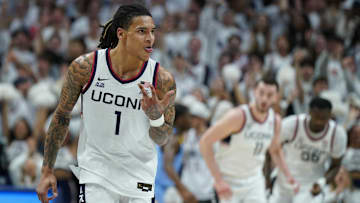 Mar 5, 2025; Storrs, Connecticut, USA; UConn Huskies guard Solo Ball (1) reacts after his three point basket against the Marquette Golden Eagles in the first half at Harry A. Gampel Pavilion. Mandatory Credit: David Butler II-Imagn Images