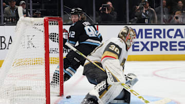 Nov 24, 2025; Salt Lake City, Utah, USA; Utah Mammoth center Logan Cooley (92) looks back to watch the puck go in the net past Vegas Golden Knights goaltender Carl Lindbom (30) during the third period at Delta Center. Mandatory Credit: Rob Gray-Imagn Images