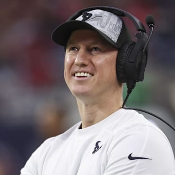 Houston Texans offensive coordinator Bobby Slowik smiles on the sidelines.