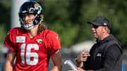 Jacksonville Jaguars quarterback Trevor Lawrence (16) gets coached by Jaguars Head Coach Liam Coen during the Jaguars 14th NFL training camp session at Miller Electric Center Tuesday August 12, 2025 in Jacksonville, Fla. The Jaguars travel to New Orleans to play the Saints this Sunday in their second preseason game. [Doug Engle/Florida Times-Union]