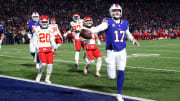 Buffalo Bills quarterback Josh Allen (17) scores a first half touchdown against the Chiefs .