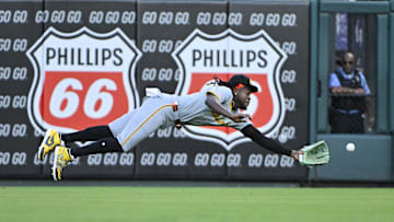 Sep 19, 2024; St. Louis, Missouri, USA;  Pittsburgh Pirates center fielder Oneil Cruz (15) dives and catches a line drive hit by St. Louis Cardinals shortstop Masyn Winn (not pictured) during the first inning at Busch Stadium. Mandatory Credit: Jeff Curry-Imagn Images