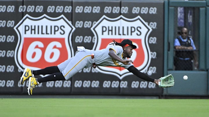 Sep 19, 2024; St. Louis, Missouri, USA;  Pittsburgh Pirates center fielder Oneil Cruz (15) dives and catches a line drive hit by St. Louis Cardinals shortstop Masyn Winn (not pictured) during the first inning at Busch Stadium. Mandatory Credit: Jeff Curry-Imagn Images