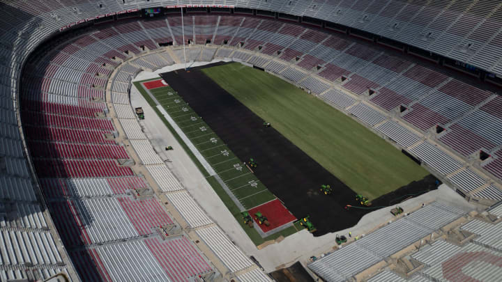 Jul 30, 2024; Columbus, Ohio, USA; Sheets of sod grass are put down over the artificial turf inside Ohio Stadium in preparation for this weekend's Manchester City - Chelsea FC English Premier League exhibition soccer match.