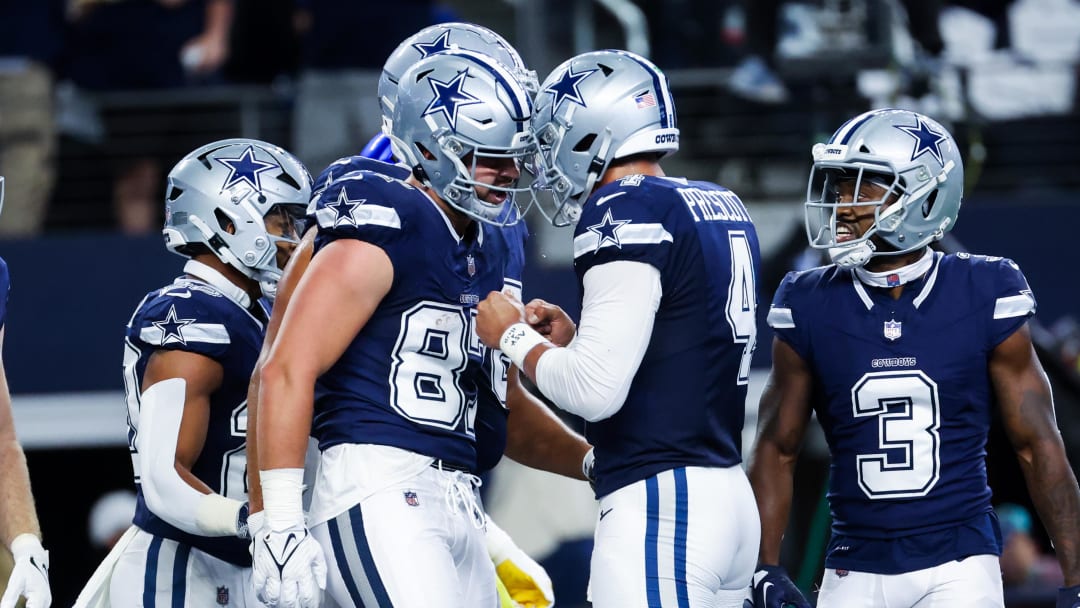 Oct 29, 2023; Arlington, Texas, USA;  Dallas Cowboys tight end Jake Ferguson (87) celebrates with Dallas Cowboys quarterback Dak Prescott (4) after catching a touchdown pass during the first quarter against the Los Angeles Rams at AT&T Stadium. Mandatory Credit: Kevin Jairaj-USA TODAY Sports