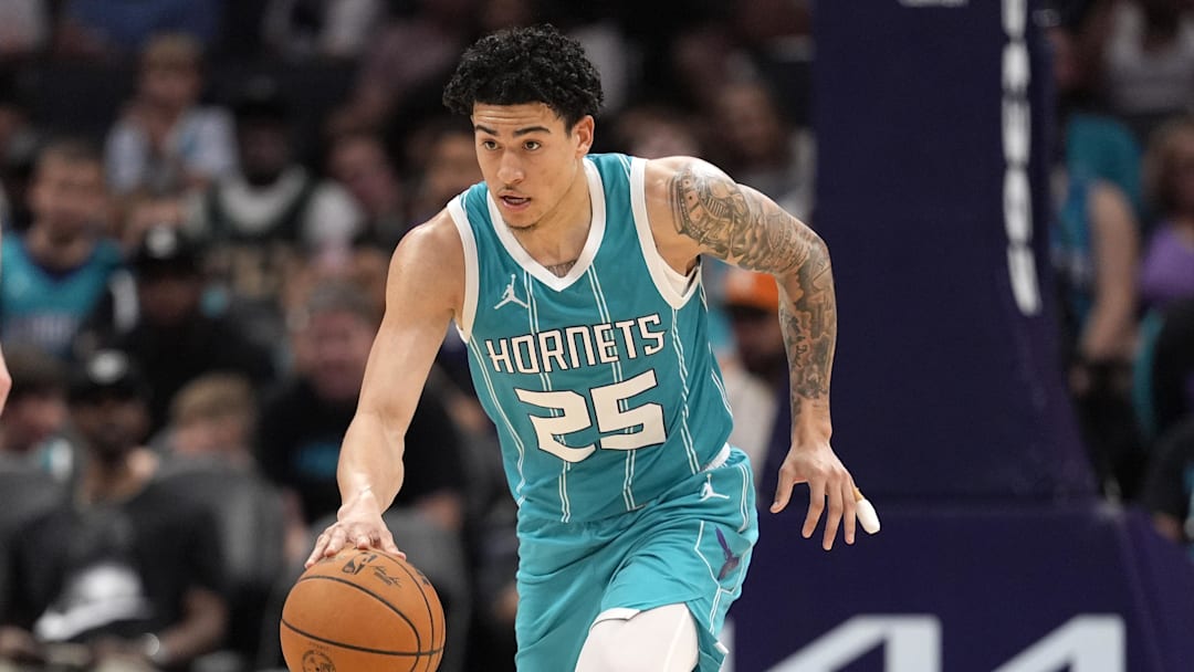 Apr 4, 2025; Charlotte, North Carolina, USA; Charlotte Hornets guard KJ Simpson (25) brings the ball up court during the second half against the Sacramento Kings at Spectrum Center. Mandatory Credit: Jim Dedmon-Imagn Images