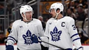 Dec 7, 2024; Pittsburgh, Pennsylvania, USA;  Toronto Maple Leafs defenseman Morgan Rielly (44) and center Auston Matthews (34) talk before a face-off against the Pittsburgh Penguins during the second period at PPG Paints Arena. Mandatory Credit: Charles LeClaire-Imagn Images