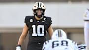 Aug 30, 2025; Nashville, Tennessee, USA;  Vanderbilt Commodores linebacker Langston Patterson (10) looks over the defense against the Charleston Southern Buccaneers during the first half at FirstBank Stadium. Mandatory Credit: Steve Roberts-Imagn Images