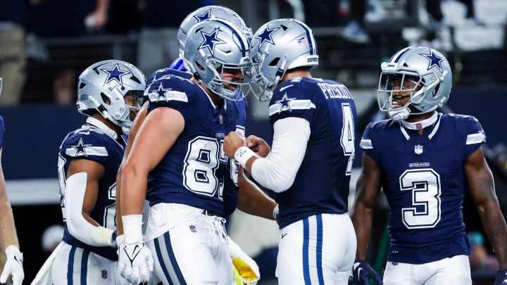 Oct 29, 2023; Arlington, Texas, USA;  Dallas Cowboys tight end Jake Ferguson (87) celebrates with Dallas Cowboys quarterback Dak Prescott (4) after catching a touchdown pass during the first quarter against the Los Angeles Rams at AT&T Stadium. Mandatory Credit: Kevin Jairaj-USA TODAY Sports