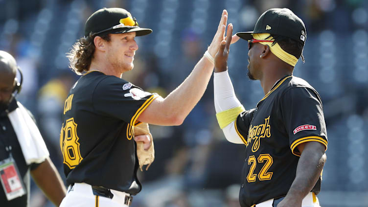 Sep 8, 2024; Pittsburgh, Pennsylvania, USA;  Pittsburgh Pirates first baseman Billy Cook (28) and designated hitter Andrew McCutchen (22) high-five after defeating the Washington Nationals at PNC Park. Pittsburgh won 7-3. Mandatory Credit: Charles LeClaire-Imagn Images