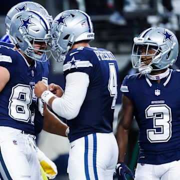 Oct 29, 2023; Arlington, Texas, USA;  Dallas Cowboys tight end Jake Ferguson (87) celebrates with Dallas Cowboys quarterback Dak Prescott (4) after catching a touchdown pass during the first quarter against the Los Angeles Rams at AT&T Stadium. Mandatory Credit: Kevin Jairaj-Imagn Images