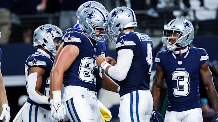 Oct 29, 2023; Arlington, Texas, USA;  Dallas Cowboys tight end Jake Ferguson (87) celebrates with Dallas Cowboys quarterback Dak Prescott (4) after catching a touchdown pass during the first quarter against the Los Angeles Rams at AT&T Stadium. Mandatory Credit: Kevin Jairaj-Imagn Images