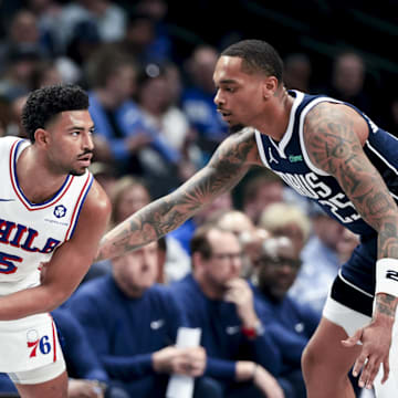 Mar 16, 2025; Dallas, Texas, USA;  Philadelphia 76ers guard Quentin Grimes (5) looks to score as Dallas Mavericks forward P.J. Washington (25) defends during the first half at American Airlines Center. Mandatory Credit: Kevin Jairaj-Imagn Images