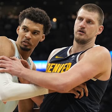 Jan 4, 2025; San Antonio, Texas, USA; San Antonio Spurs center Victor Wembanyama (1) and Denver Nuggets center Nikola Jokic (15) battle for position during an inbound pass in the second half at Frost Bank Center. Mandatory Credit: Scott Wachter-Imagn Images