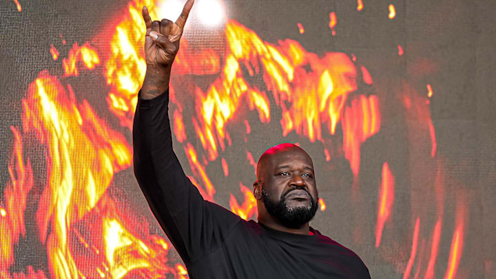 Shaquille O'Neal holds up the sign of the horns during a DJ performance ahead of the College Football Playoff semifinal game between the Texas Longhorns and Ohio State in the Cotton Bowl at AT&T Stadium on Friday, Jan. 10, 2024 in Arlington, Texas.