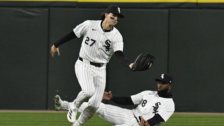 Apr 16, 2025; Chicago, Illinois, USA;  Chicago White Sox left fielder Brooks Baldwin (27), catches a fly ball hit by Athletics third base Luis Urías (17) as outfielder Luis Robert Jr. (88) covers during the sixth inning  at Rate Field. Mandatory Credit: Matt Marton-Imagn Images