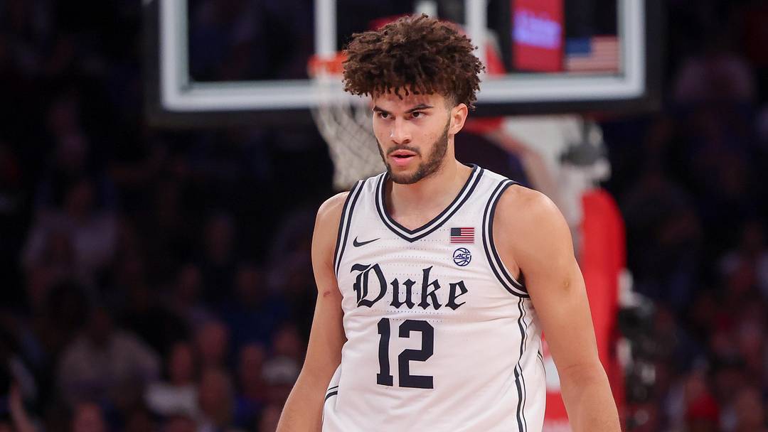 Nov 18, 2025; New York, New York, USA; Duke Blue Devils forward Cameron Boozer (12) reacts against the Kansas Jayhawks during the second half at Madison Square Garden. Mandatory Credit: Vincent Carchietta-Imagn Images