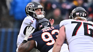Dec 31, 2023; Chicago, Illinois, USA;  Chicago Bears defensive lineman Justin Jones (93) hits Atlanta Falcons quarterback Taylor Heinicke (4) in the second half at Soldier Field. Mandatory Credit: Jamie Sabau-Imagn Images