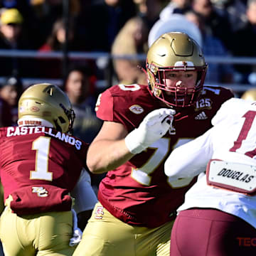 Nov 11, 2023; Chestnut Hill, Massachusetts, USA; Boston College Eagles offensive lineman Ozzy Trapilo (70) blocks Virginia Tech Hokies defensive lineman Cole Nelson (17) during the first half at Alumni Stadium. Mandatory Credit: Eric Canha-Imagn Images