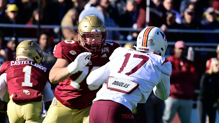 Nov 11, 2023; Chestnut Hill, Massachusetts, USA; Boston College Eagles offensive lineman Ozzy Trapilo (70) blocks Virginia Tech Hokies defensive lineman Cole Nelson (17) during the first half at Alumni Stadium. Mandatory Credit: Eric Canha-Imagn Images