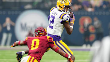 Sep 1, 2024; Paradise, Nevada, USA; LSU Tigers wide receiver Kyren Lacy (2) makes a catch in front of Southern California Trojans safety Akili Arnold (0) during the first quarter at Allegiant Stadium. Mandatory Credit: Stephen R. Sylvanie-Imagn Images