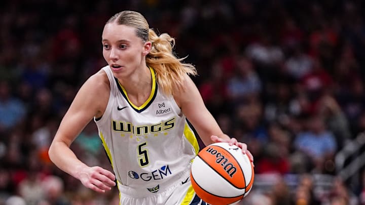 Dallas Wings guard Paige Bueckers (5) rushes up the court during the game at Gainbridge Fieldhouse in Indianapolis. The Dallas Wings defeated the Indiana Fever, 81-80.