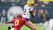 Sep 1, 2024; Paradise, Nevada, USA; LSU Tigers wide receiver Kyren Lacy (2) makes a catch in front of Southern California Trojans safety Akili Arnold (0) during the first quarter at Allegiant Stadium. Mandatory Credit: Stephen R. Sylvanie-USA TODAY Sports