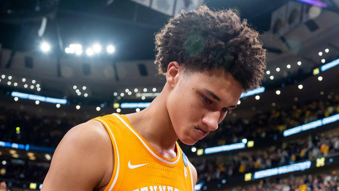 Tennessee forward Nate Ament (10) walks off the court as Michigan players celebrate their Final Four berth behind him after a NCAA Tournament Elite 8 game between Tennessee and Michigan at the United Center in Chicago on March 29, 2026.