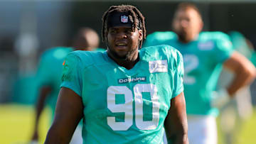 Jul 29, 2025; Miami Gardens, FL, USA; Miami Dolphins defensive tackle Kenneth Grant (90) looks on from the field during training camp at Baptist Health Training Complex. Mandatory Credit: Sam Navarro-Imagn Images