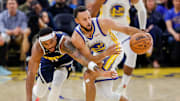 Golden State Warriors guard Stephen Curry (30) steals the ball from Denver Nuggets guard BruceBrown (11) during the second quarter at Chase Center.