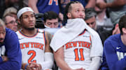 May 10, 2025; New York, New York, USA; New York Knicks guards Miles McBride (2) and Jalen Brunson (11) sit on the bench in the closing minute of the fourth quarter against the Boston Celtics during game three of the second round for the 2025 NBA Playoffs at Madison Square Garden. Mandatory Credit: Wendell Cruz-Imagn Images