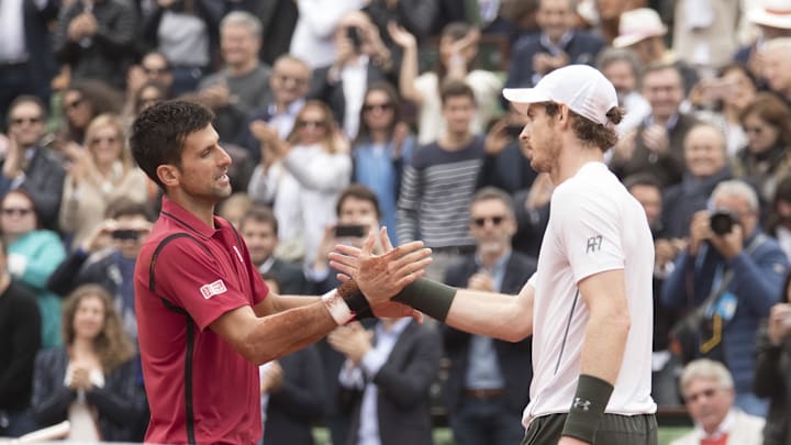Novak Djokovic and Andy Murray shake hands at the net after their match at the 2016 French Open. 