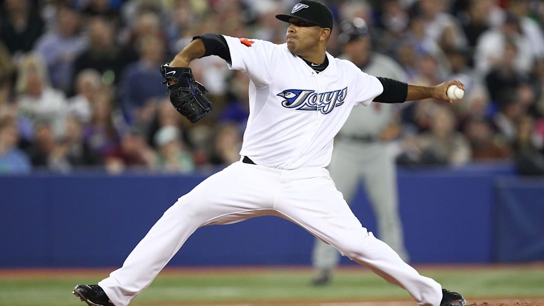 Apr 1, 2011; Toronto, ON, Canada; Toronto Blue Jays starting pitcher Ricky Romero (24) delivers a pitch against the Minnesota Twins at the Rogers Centre. The Blue Jays beat the Twins 13-3. Mandatory Credit: Tom Szczerbowski-Imagn Images