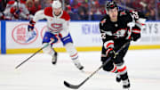 Mar 1, 2025; Buffalo, New York, USA;  Buffalo Sabres right wing Jack Quinn (22) looks to make a pass during the second period against the Montreal Canadiens at KeyBank Center. Mandatory Credit: Timothy T. Ludwig-Imagn Images