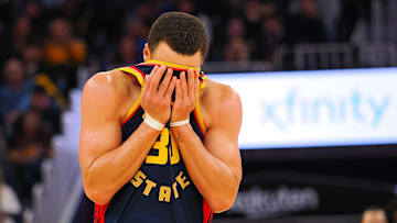 Jan 5, 2025; San Francisco, California, USA; Golden State Warriors guard Stephen Curry (30) wipes sweat off his forehead during the third quarter against the Sacramento Kings at Chase Center. Mandatory Credit: Kelley L Cox-Imagn Images