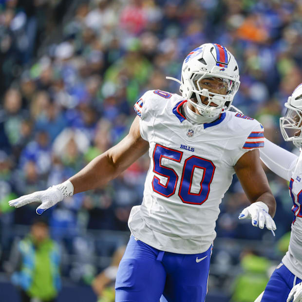 Buffalo Bills defensive end Greg Rousseau celebrates with defensive end Dawuane Smoot after blocking a pass against Seattle. Buffalo Bills defensive end Greg Rousseau celebrates with defensive end Dawuane Smoot after blocking a pass against Seattle.