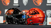 Oregon State football helmets sit on a table before the introductory press conference of the hiring of its new head football coach, JaMarcus Shephard, at Reser Stadium on Tuesday, Dec. 2, 2025, in Corvallis, Ore.