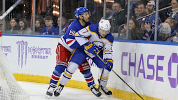 Nov 27, 2023; New York, New York, USA; Buffalo Sabres right wing John-Jason Peterka (77) is hit into