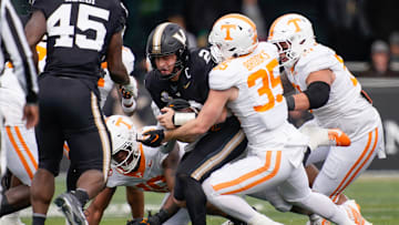 Tennessee defensive back Will Brooks (35) stops Vanderbilt quarterback Diego Pavia (2) during the second quarter at FirstBank Stadium in Nashville, Tenn., Saturday, Nov. 30, 2024.