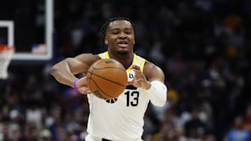 Mar 28, 2025; Denver, Colorado, USA; Utah Jazz guard Isaiah Collier (13) passes the ball in the first quarter against the Denver Nuggets at Ball Arena. Mandatory Credit: Ron Chenoy-Imagn Images