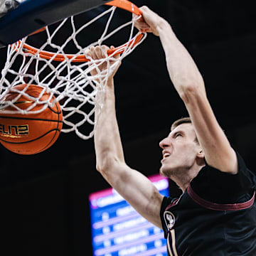 Florida State's Christian Nitu dunks against Virginia this past season. 